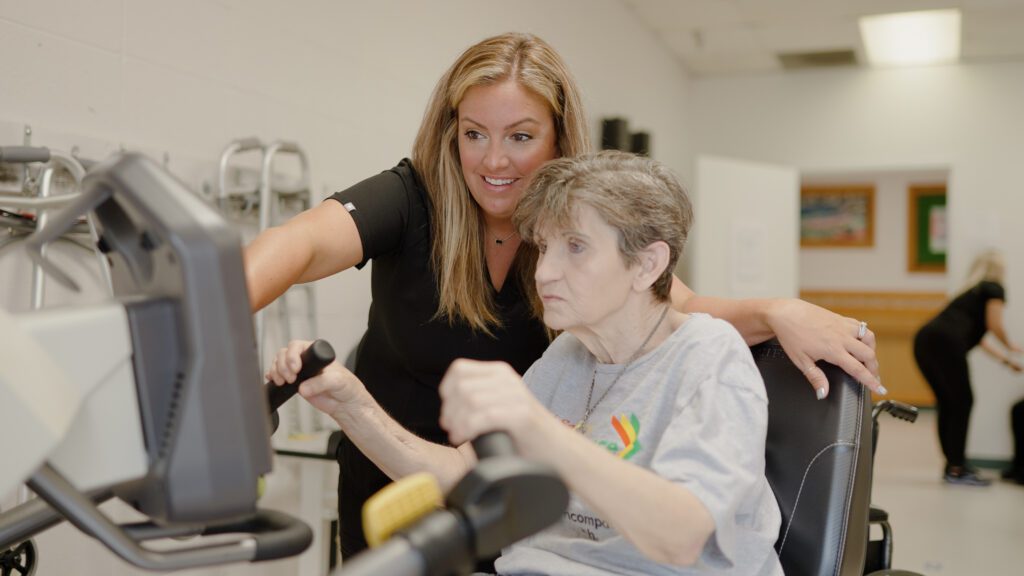 A woman on a physical therapy bike in a short term therapy program