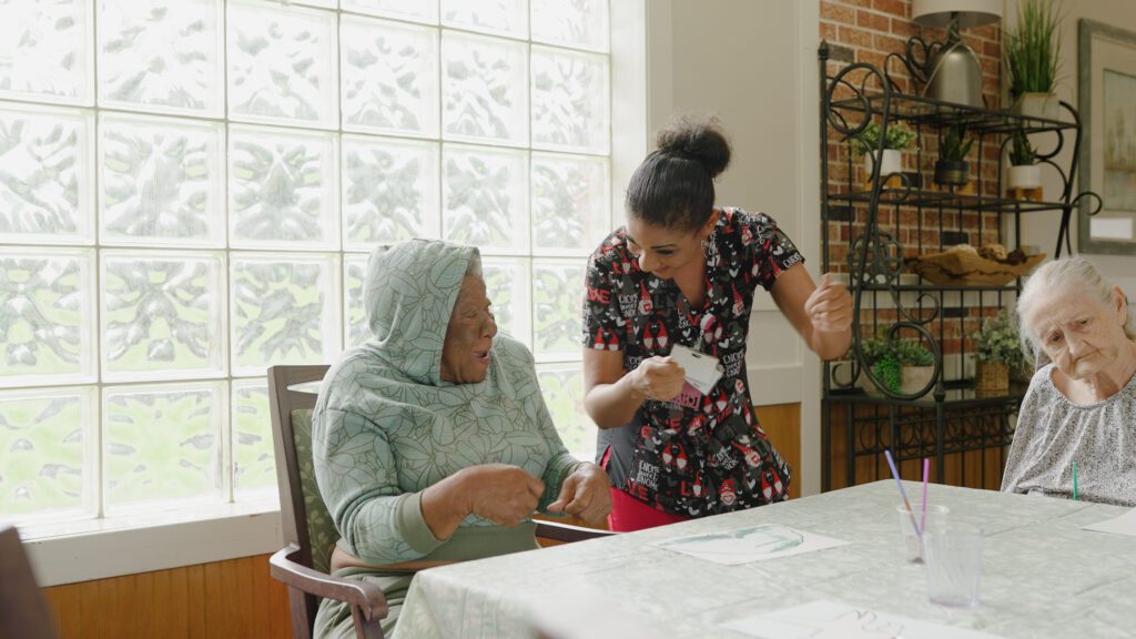 A Nurse and a long term care resident at a skilled nursing facility